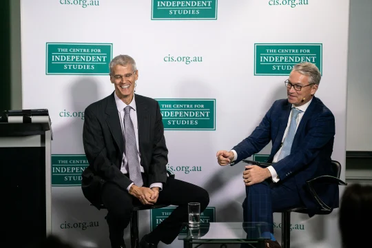 Karl Zinsmeister & Tom Switzer speaking on stage