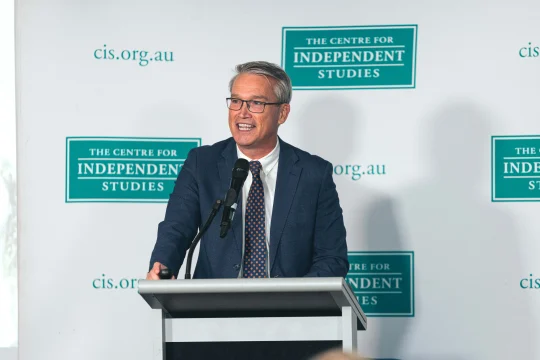 Tom Switzer speaking on stage