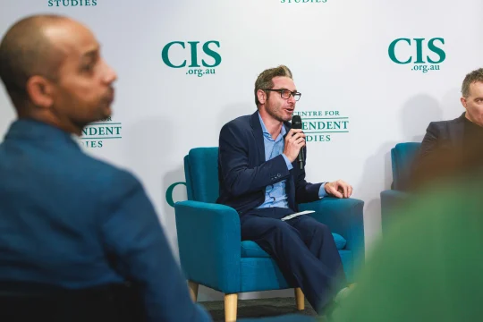 Glenn Fahey speaking on stage