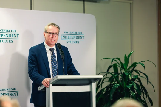 Tom Switzer speaking on stage