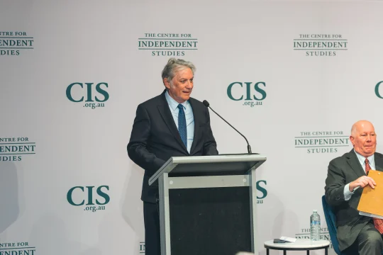 Michael Stutchbury speaking on stage