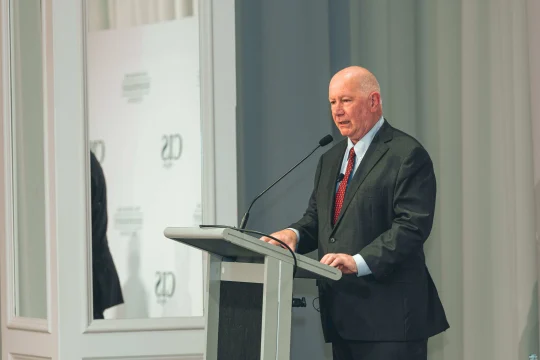 Peter Tulip speaking on stage