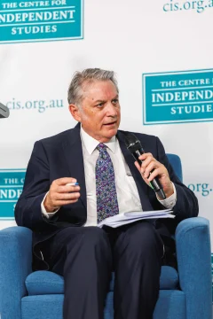 Michael Stutchbury speaking on stage