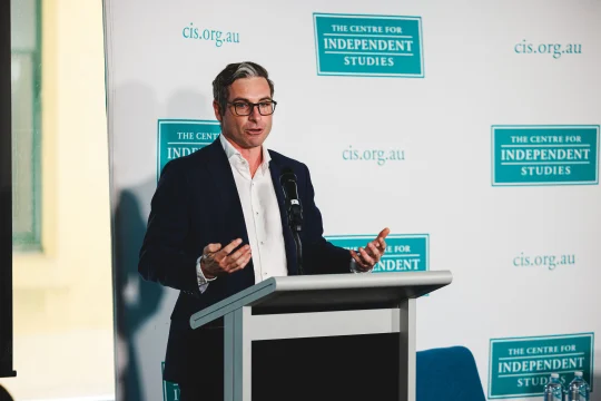 Glenn Fahey speaking on stage