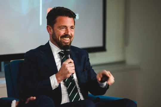 Jonathon Duniam speaking on stage