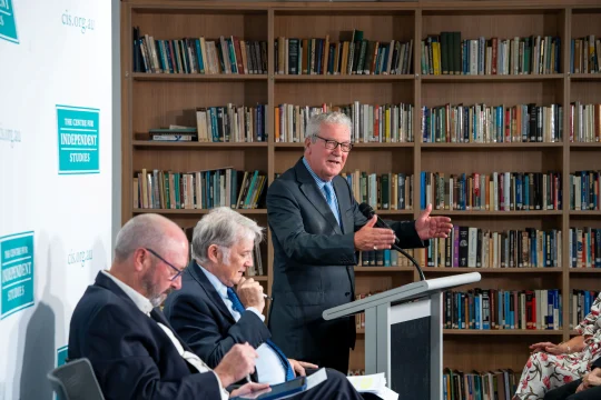 Alexander Downer speaking on stage